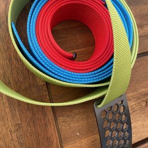 Grip 1.5 inch honeycomb belt buckle and three belts. Never worn.